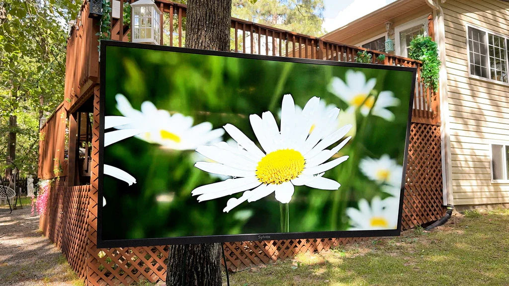 Sylvox 2000-nits outdoor TV displaying vivid movie under direct sunlight in backyard